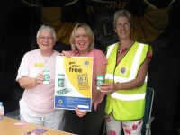 Lorely Burt helps out on the Lions Message in a Bottle stand(1)